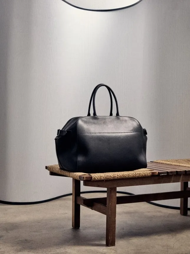 FWRD editorial imagery of designer handbags.
