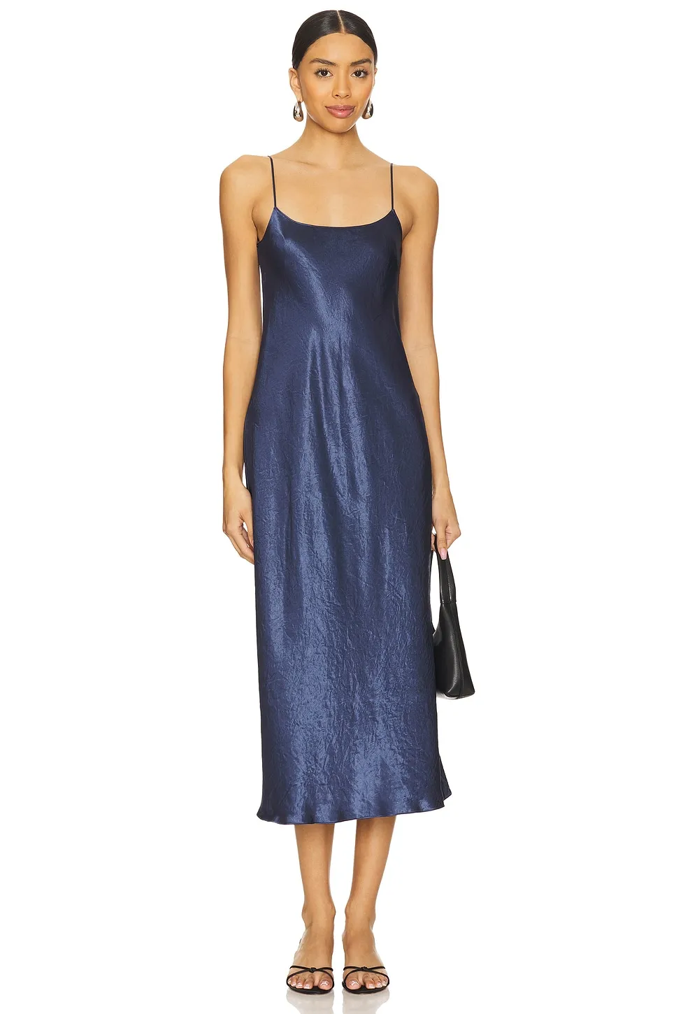 Vince silk slip dress in navy, cut straight and held by two fine straps.